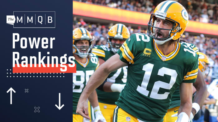 Green Bay Packers quarterback Aaron Rodgers (12) celebrates his rushing touchdown during the fourth quarter.